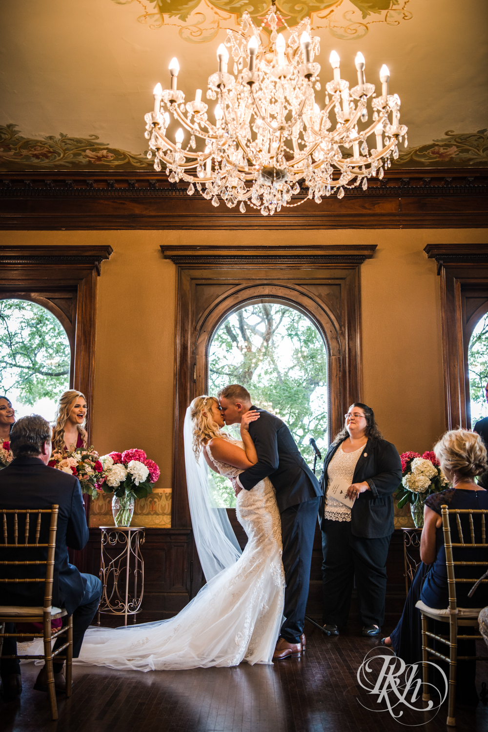 Bride and groom kiss at the Semple Mansion in Minneapolis, Minnesota.