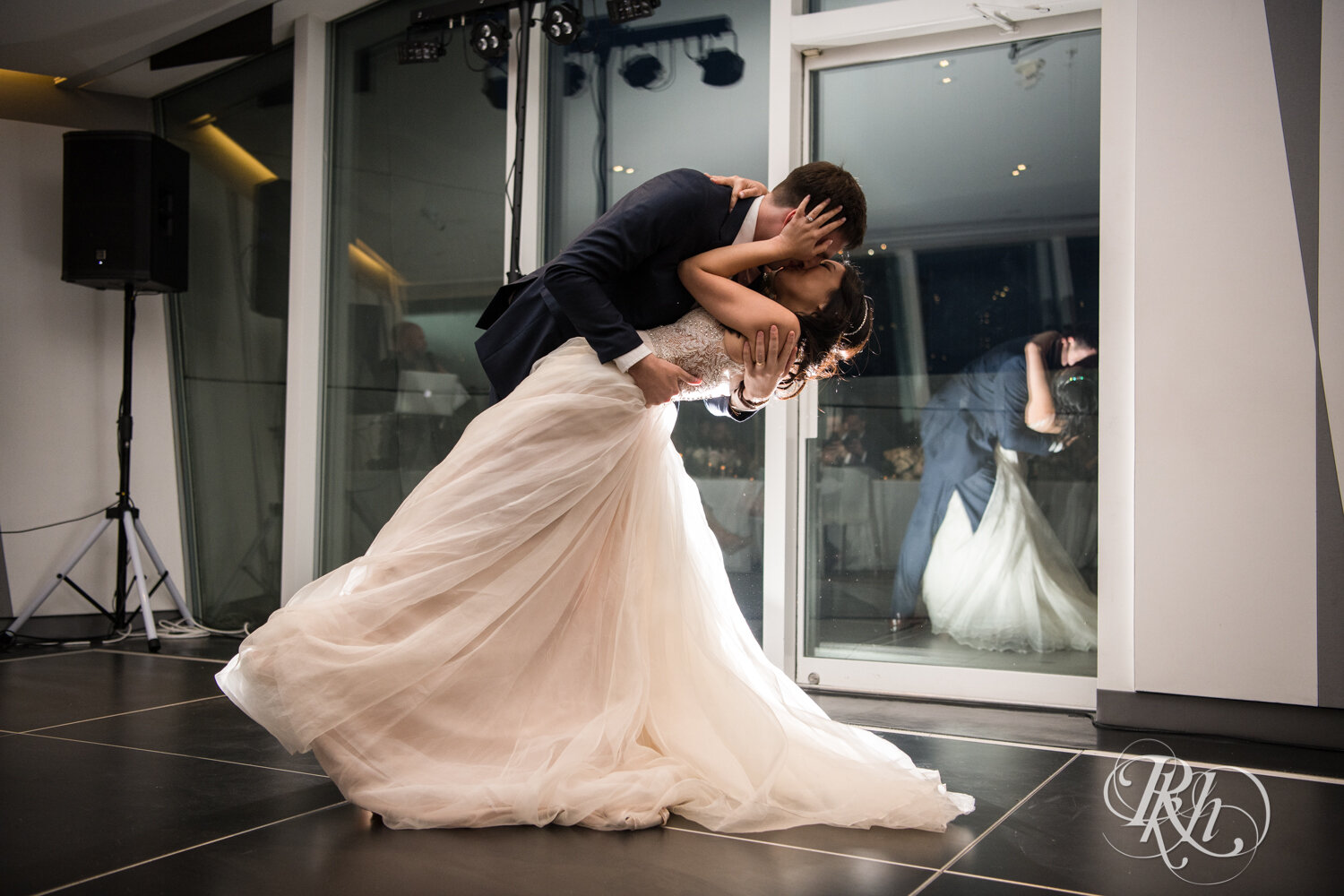 Asian bride and groom dance during wedding reception at Walker Art Center in Minneapolis, Minnesota. 