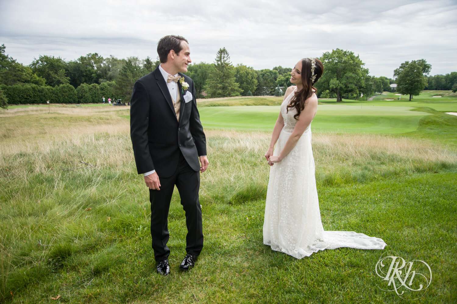 Bride and groom share first look at Olympic Hills Golf Club in Eden Prairie, Minnesota.