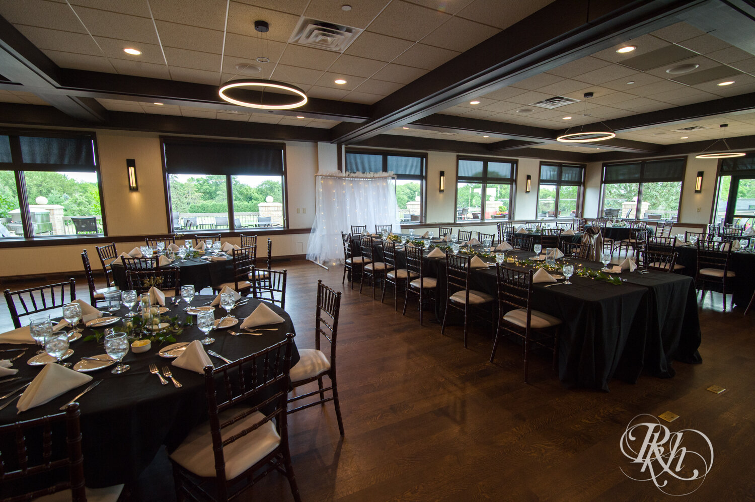 Indoor fall wedding reception setup at Olympic Hills Golf Club in Eden Prairie, Minnesota.