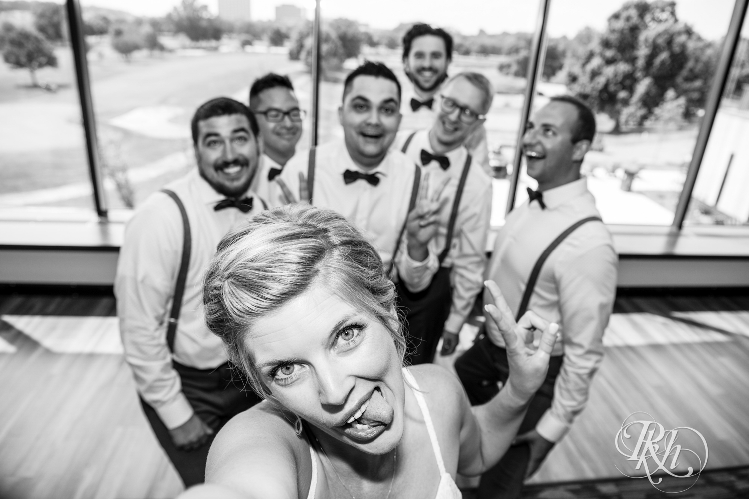 Relaxed and silly photo of bride and groomsmen