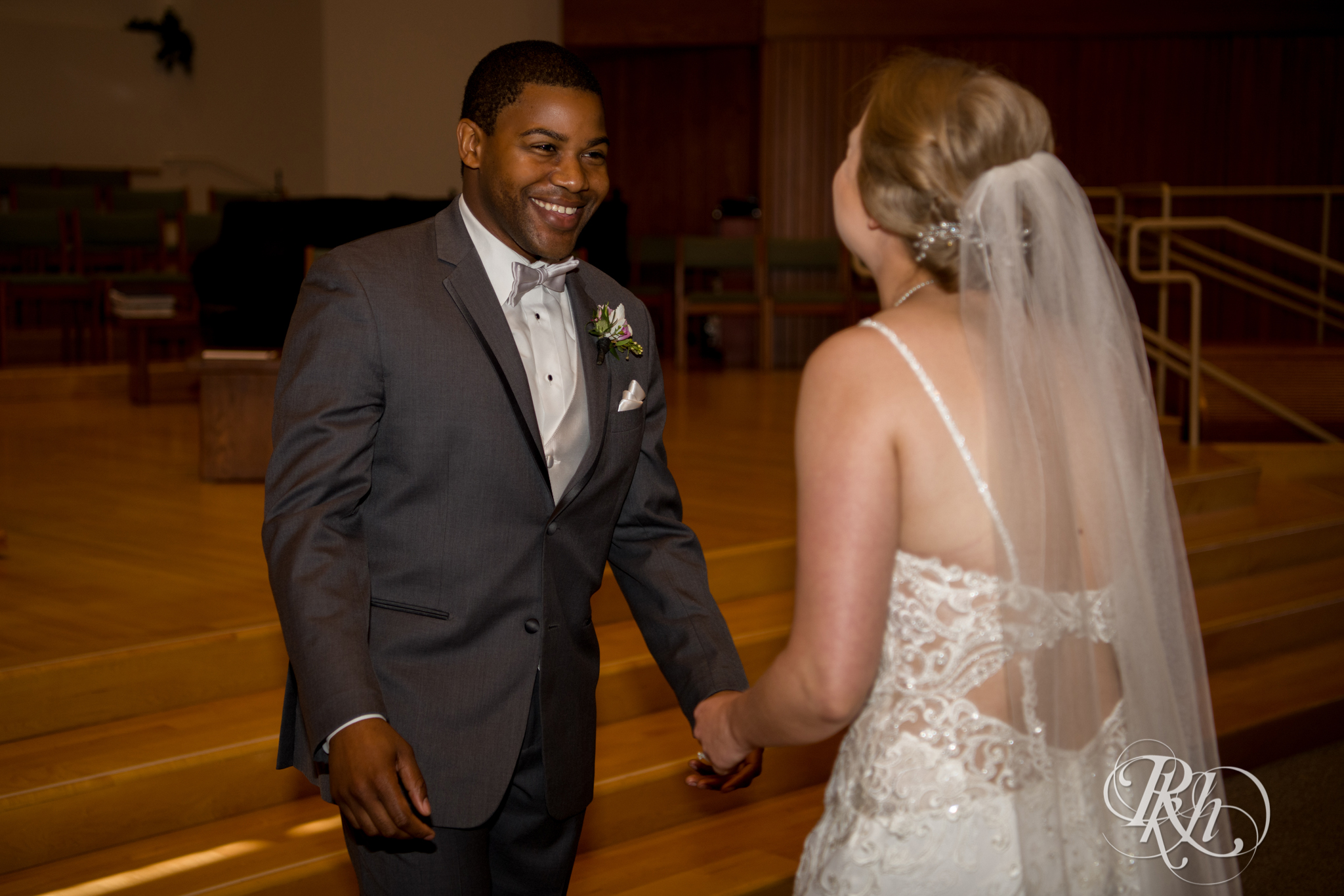 Black groom and white bride share first look at church in Richfield, Minnesota.
