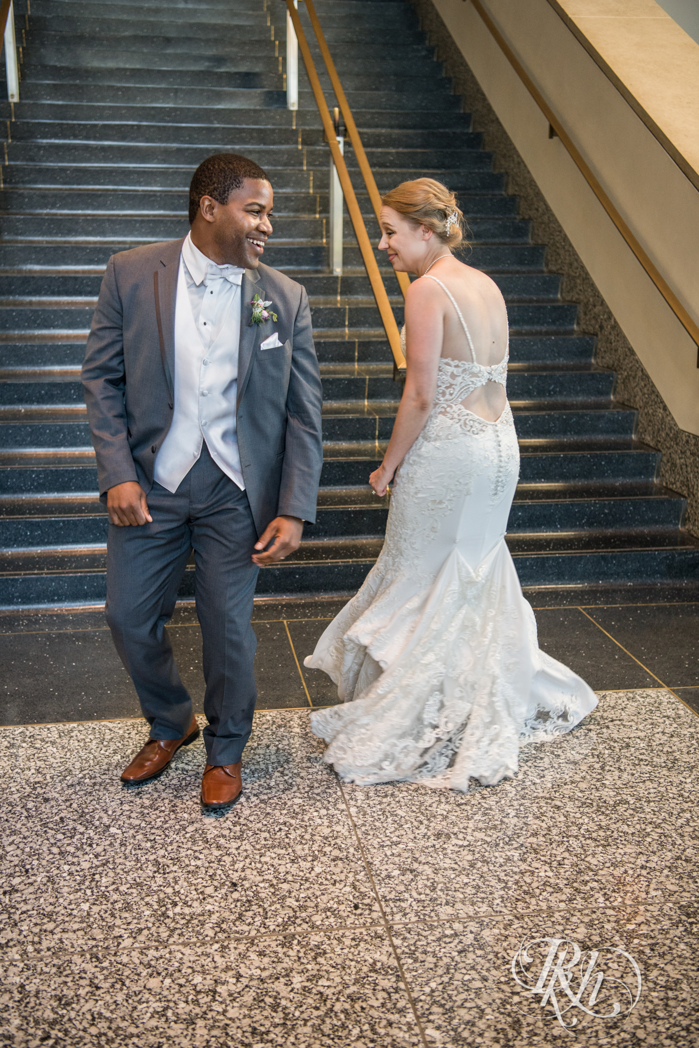 Bride and groom enter wedding reception at Minnesota History Center in Saint Paul, Minnesota.