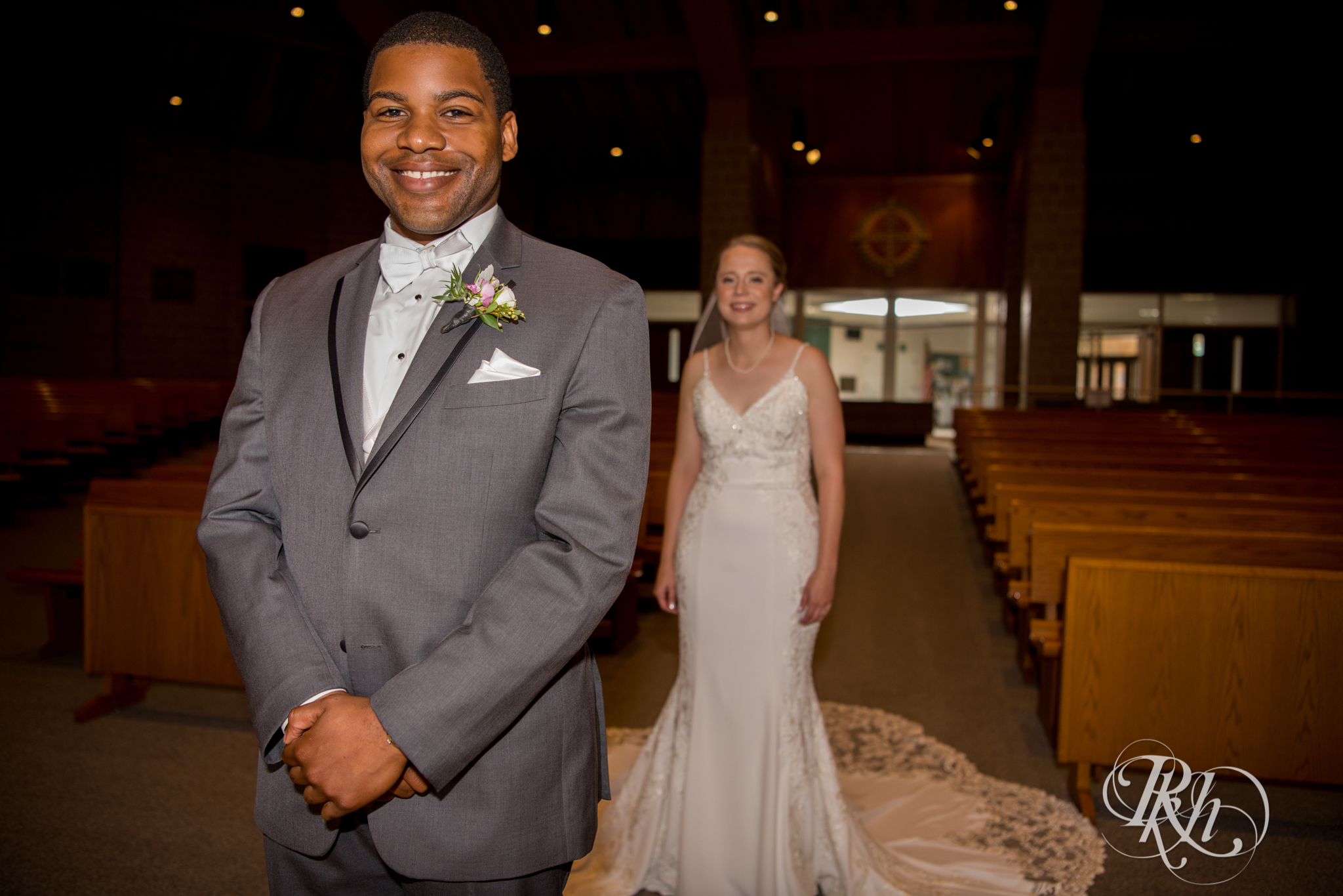 Black groom and white bride share first look at church in Richfield, Minnesota.