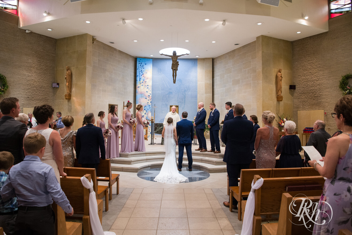 Bride and groom get married in church in Mankato, Minnesota.