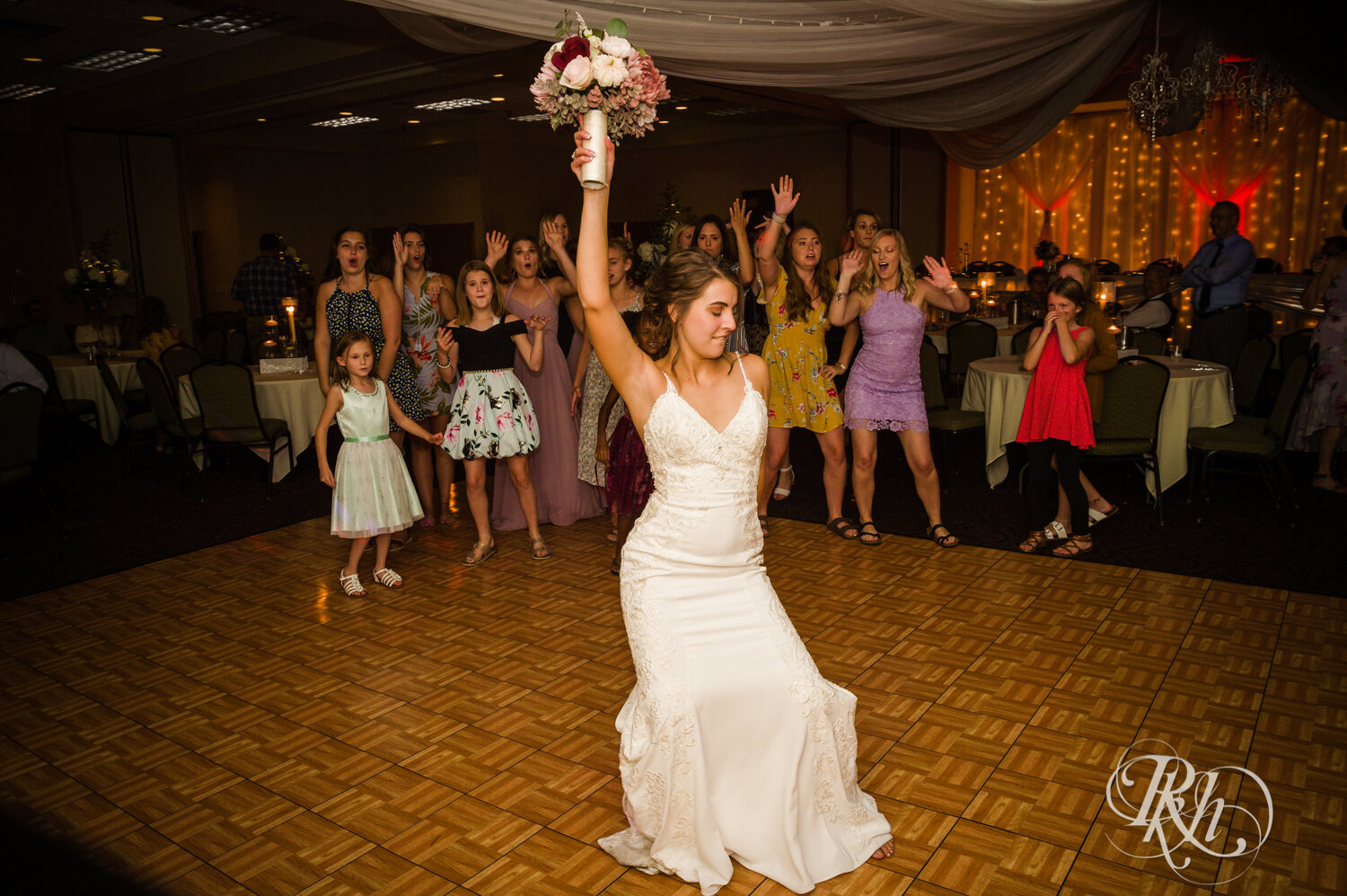 Bride tossing boquet
