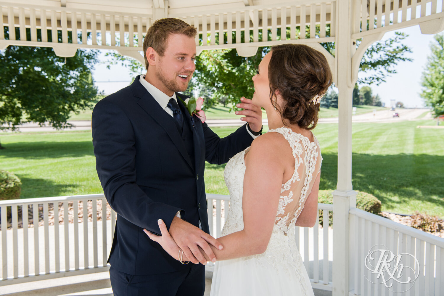 Bride and groom share first look in a gazebo at Crown Room in Rogers, Minnesota.