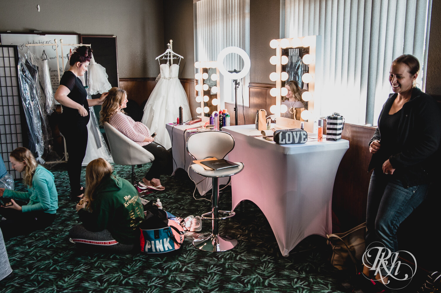Bride and bridesmaids getting ready at Rockwoods in Otsego, Minnesota.