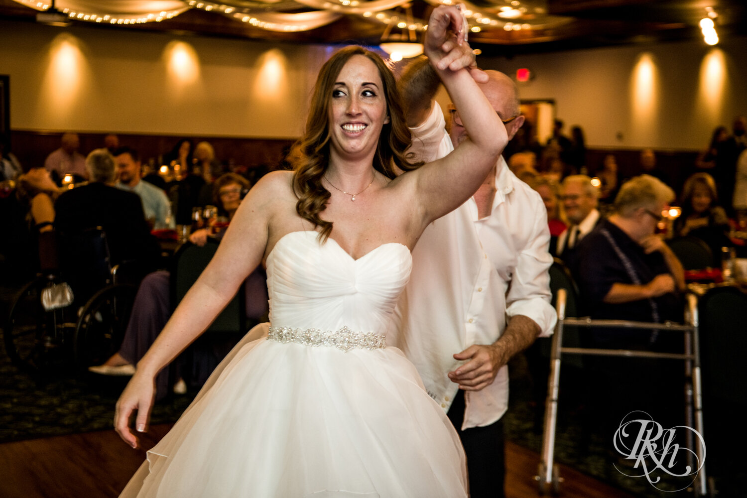 Bride and her dad dance at wedding reception at Rockwoods in Otsego, Minnesota.