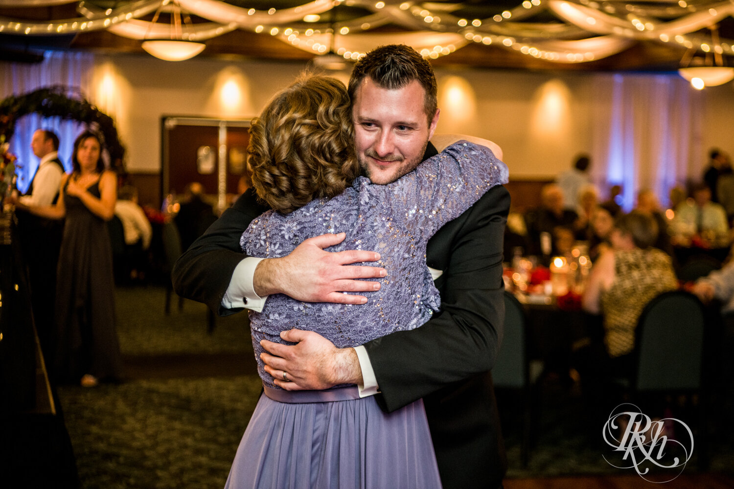 Groom and his mom dance at wedding reception at Rockwoods in Otsego, Minnesota.