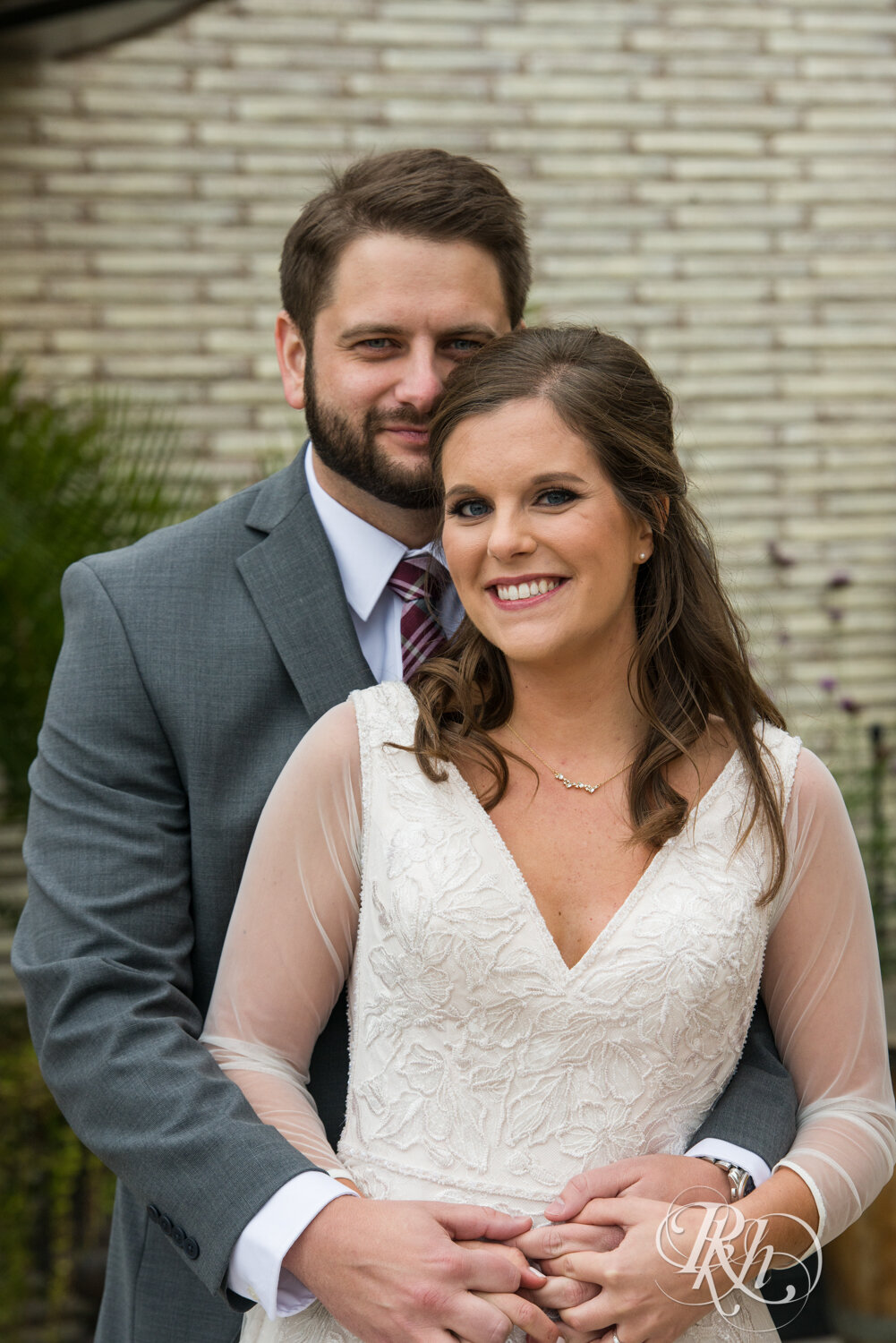 Bride and groom smile on wedding day at Kellerman's Event Center in White Bear Lake, Minnesota.