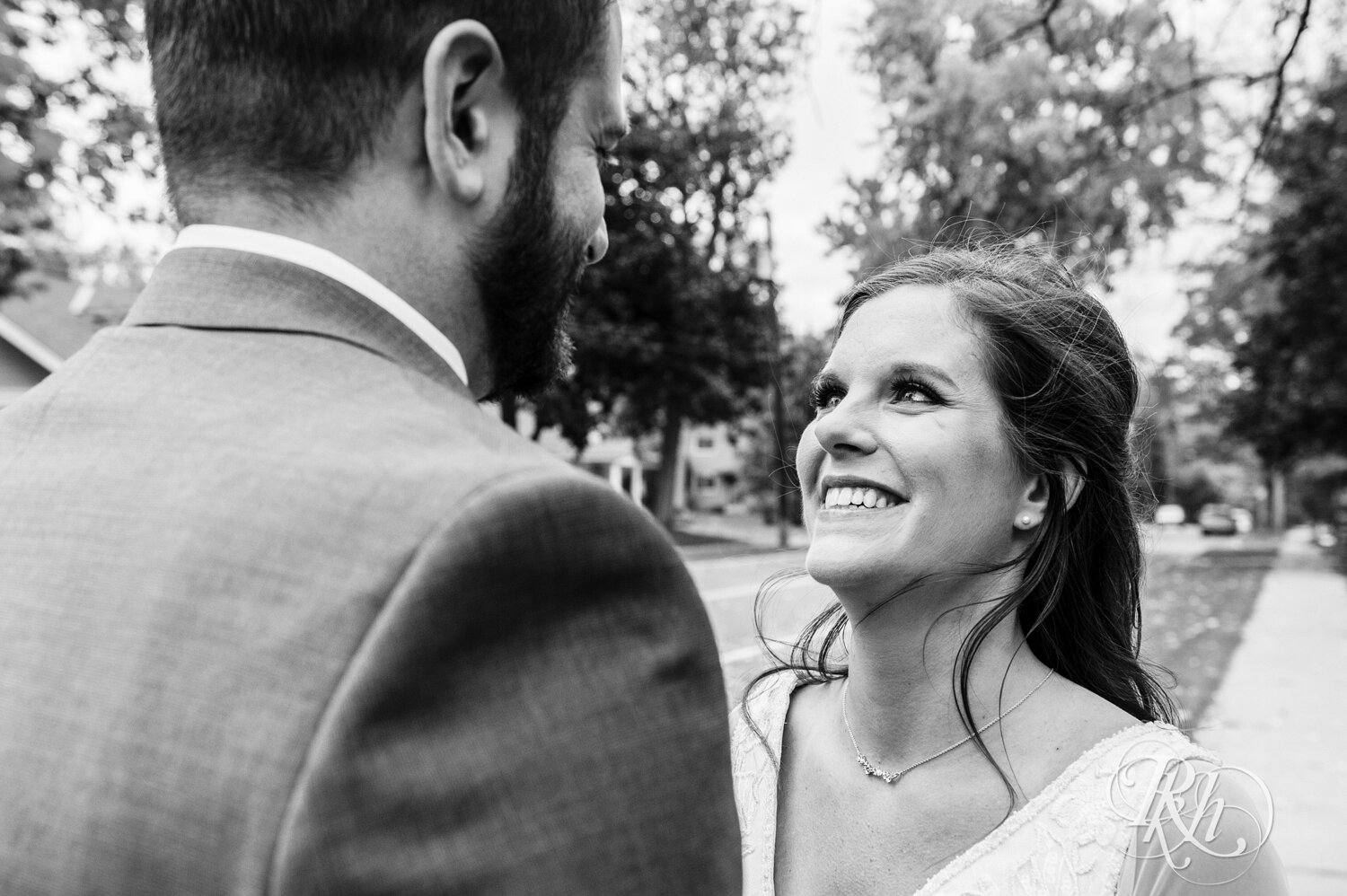 Bride and groom smile on wedding day at Kellerman's Event Center in White Bear Lake, Minnesota.