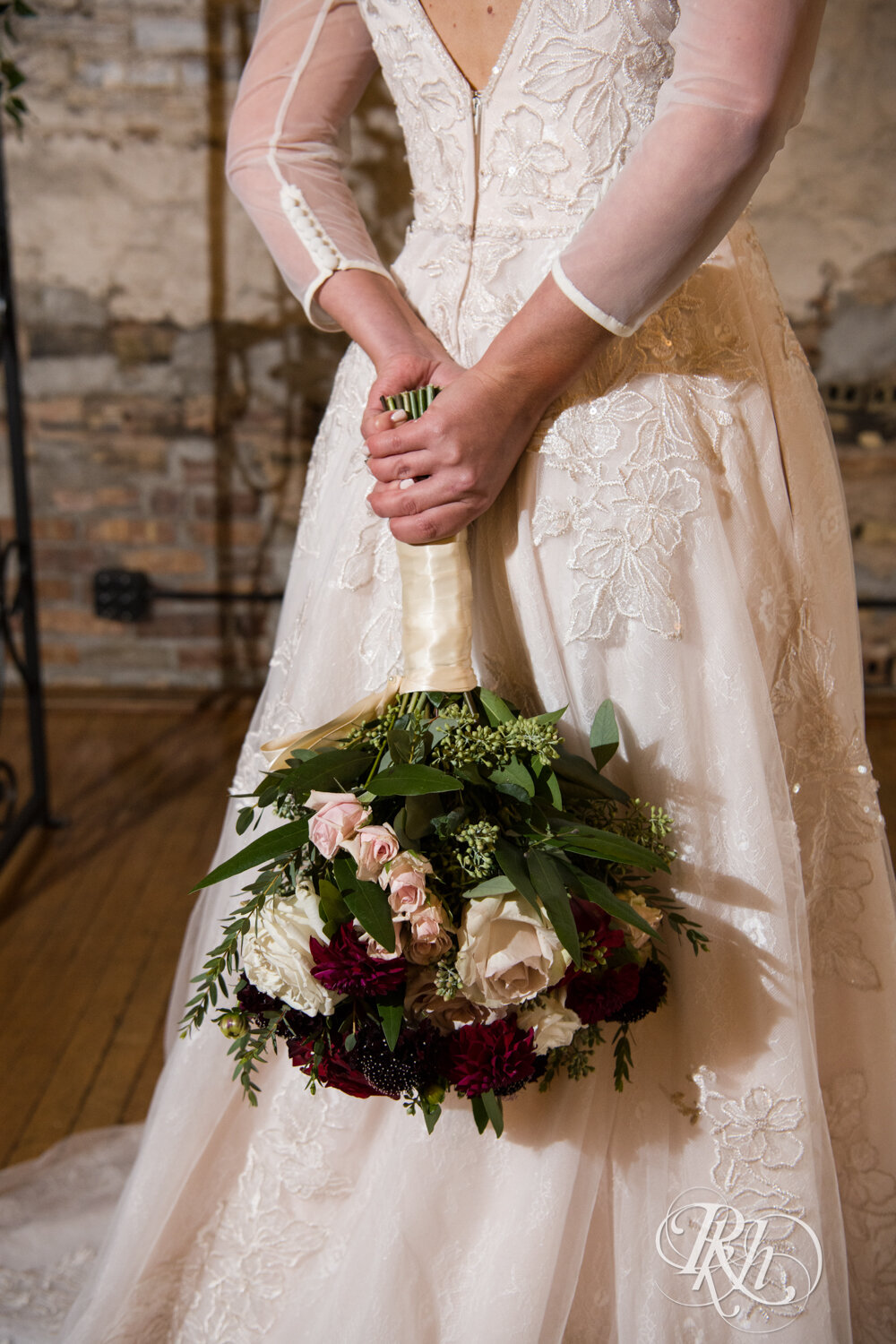 Bride holds flowers at Kellerman's Event Center in White Bear Lake, Minnesota.