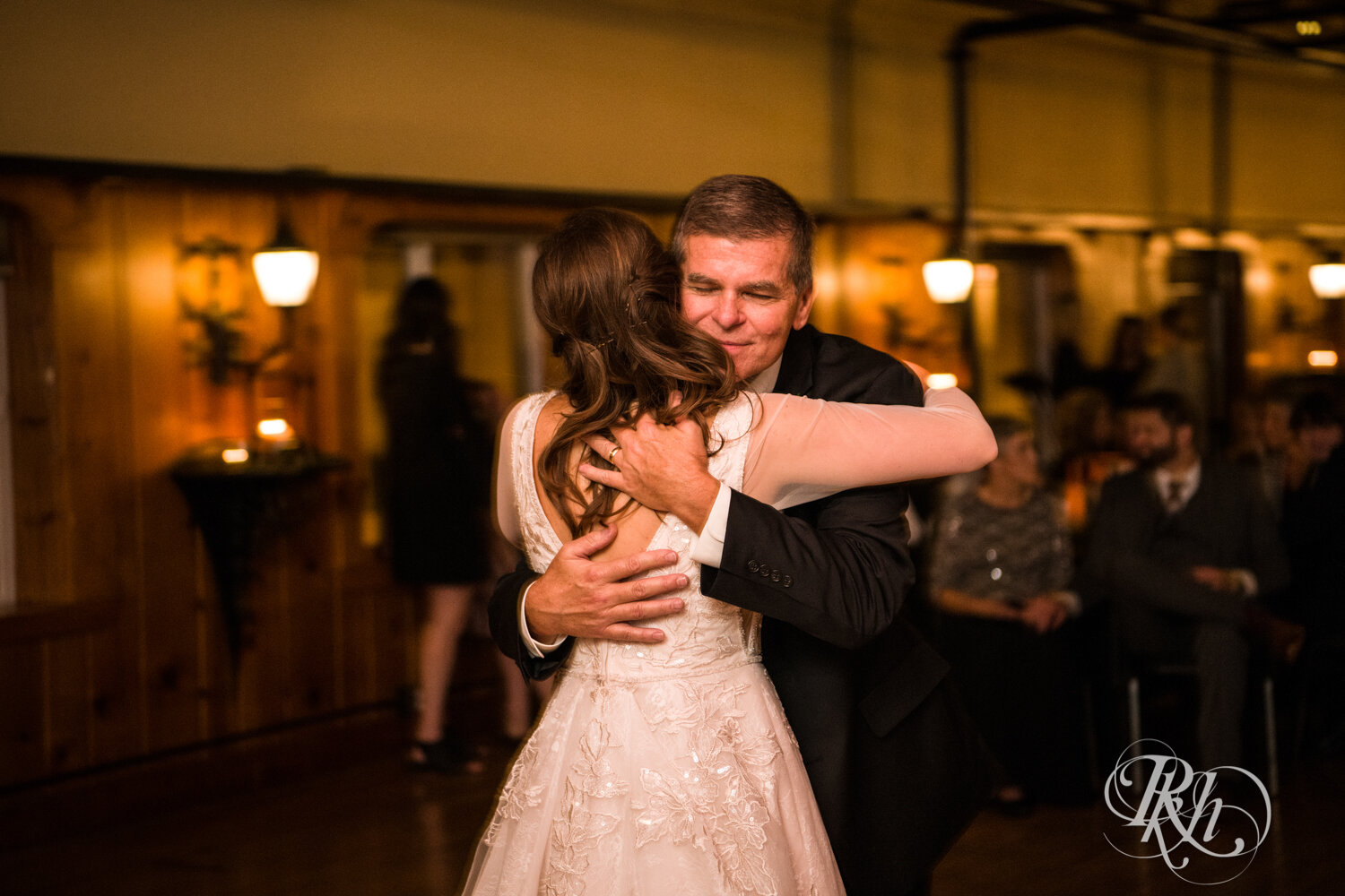 Bride and her dad dance at wedding reception at Kellerman's Event Center in White Bear Lake, Minnesota.