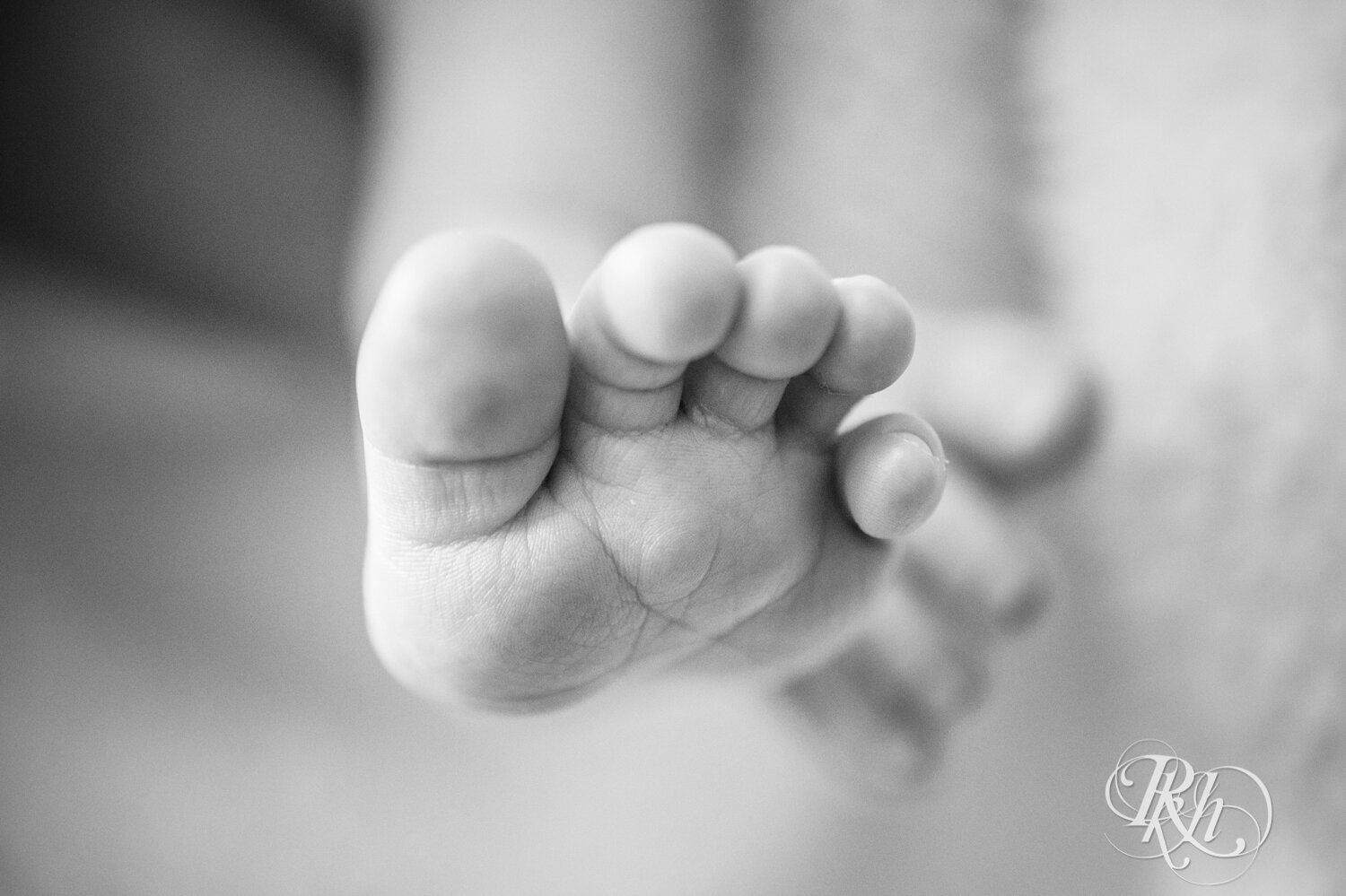 Black and white photo of baby toes.