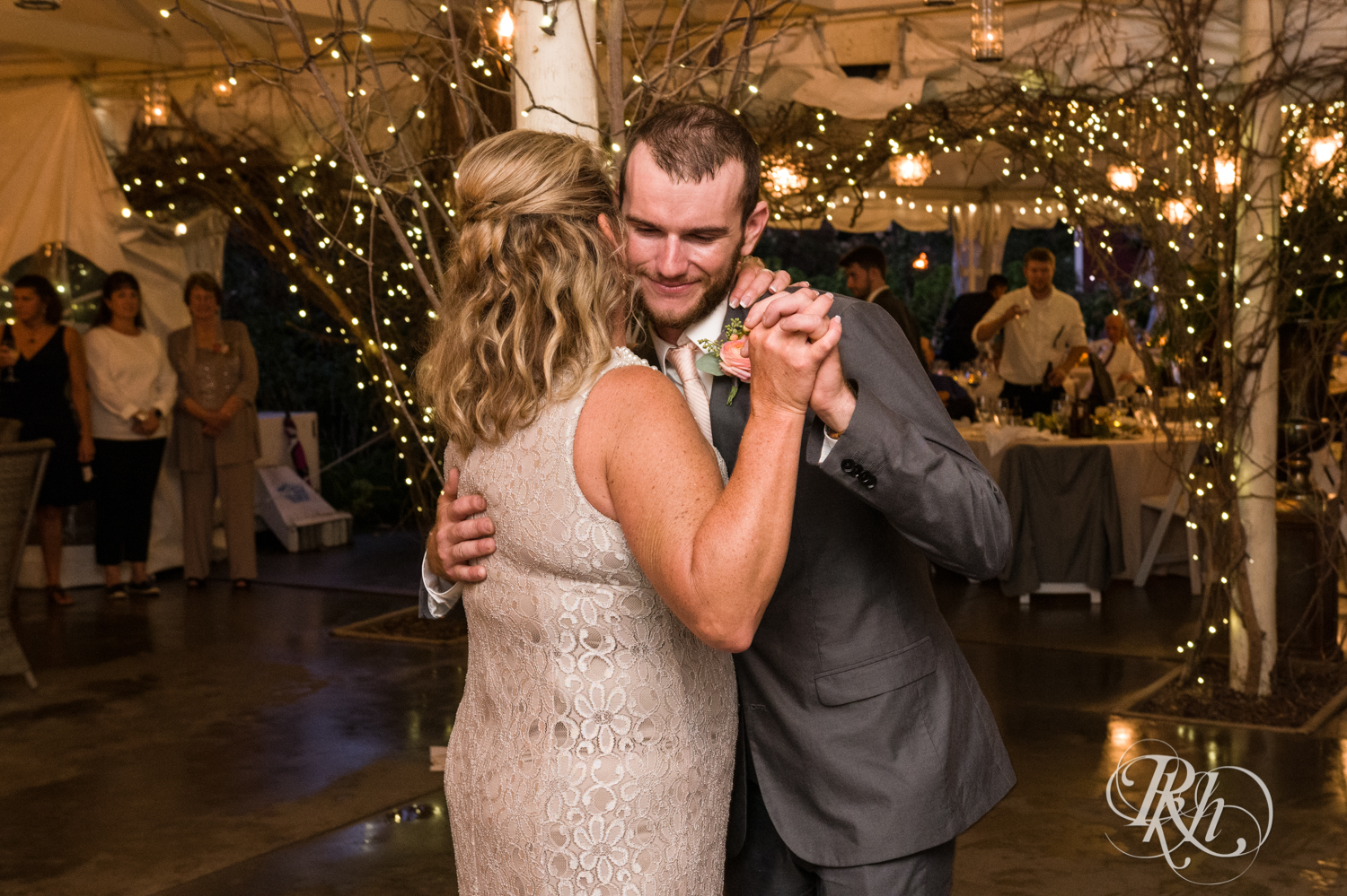 Groom and his mom dance at wedding reception at Camrose Hill in Stillwater, Minnesota.
