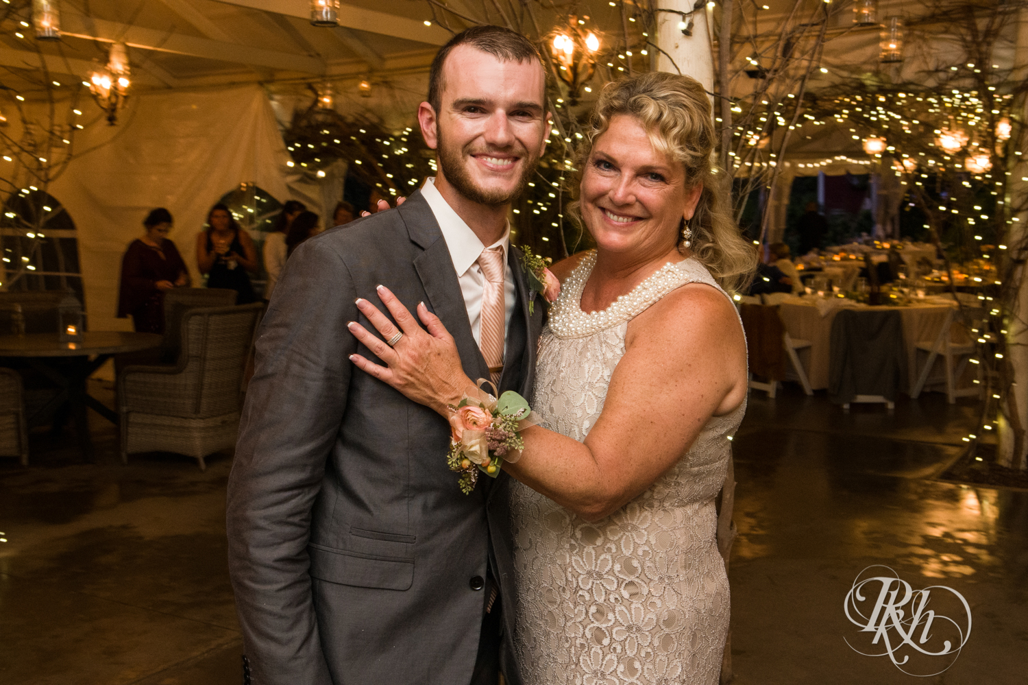 Groom and his mom dance at wedding reception at Camrose Hill in Stillwater, Minnesota.