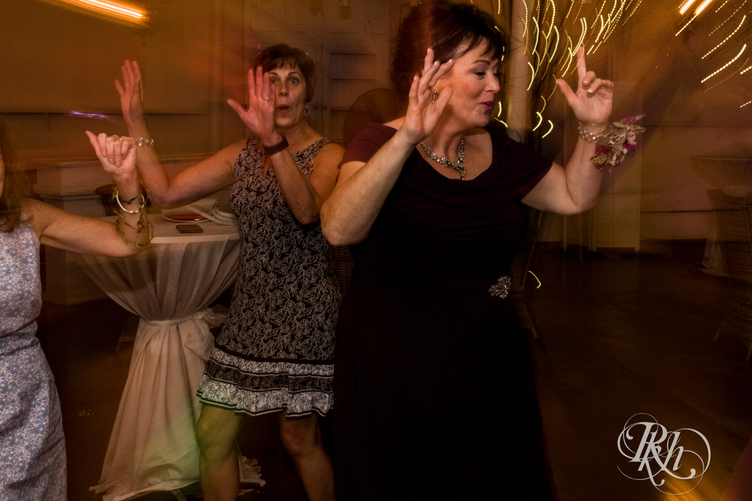 Guests dance at wedding reception at Camrose Hill in Stillwater, Minnesota.