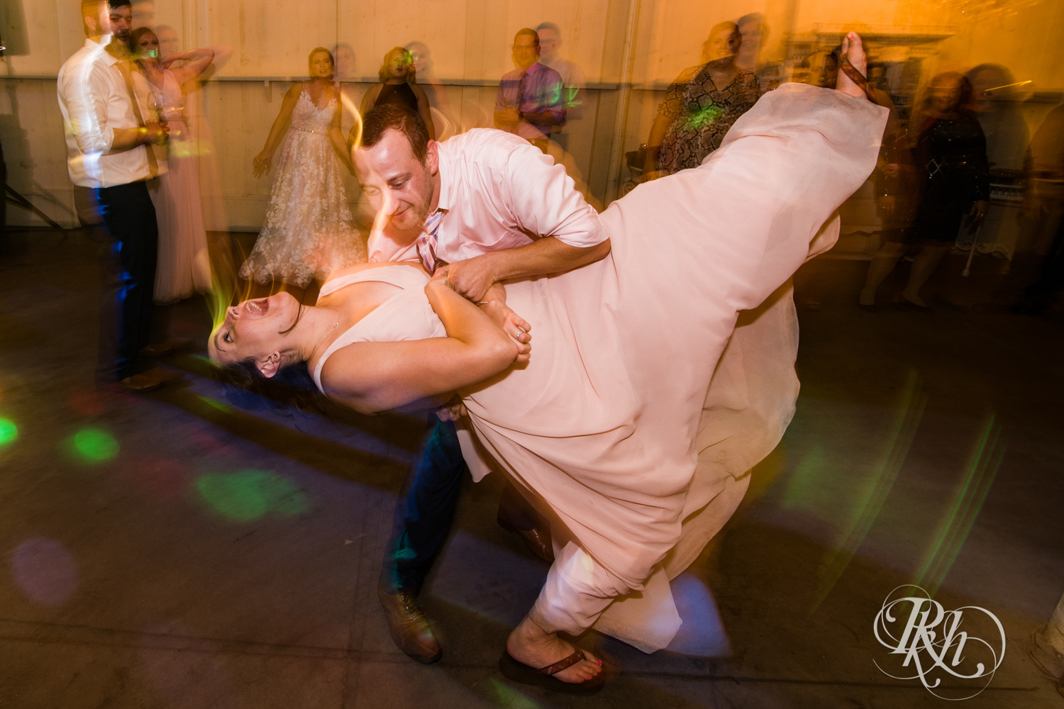 Guests dance at wedding reception at Camrose Hill in Stillwater, Minnesota.
