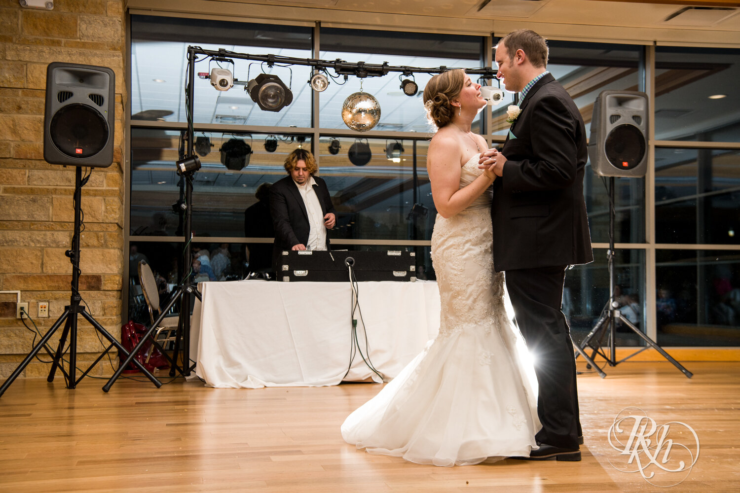 Bride and groom dance at wedding reception at Eagan Community Center in Eagan, Minnesota.