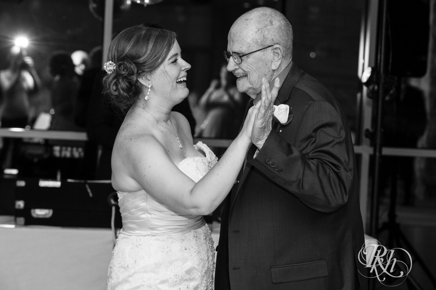 Bride and grandpa dance at wedding reception at Eagan Community Center in Eagan, Minnesota.