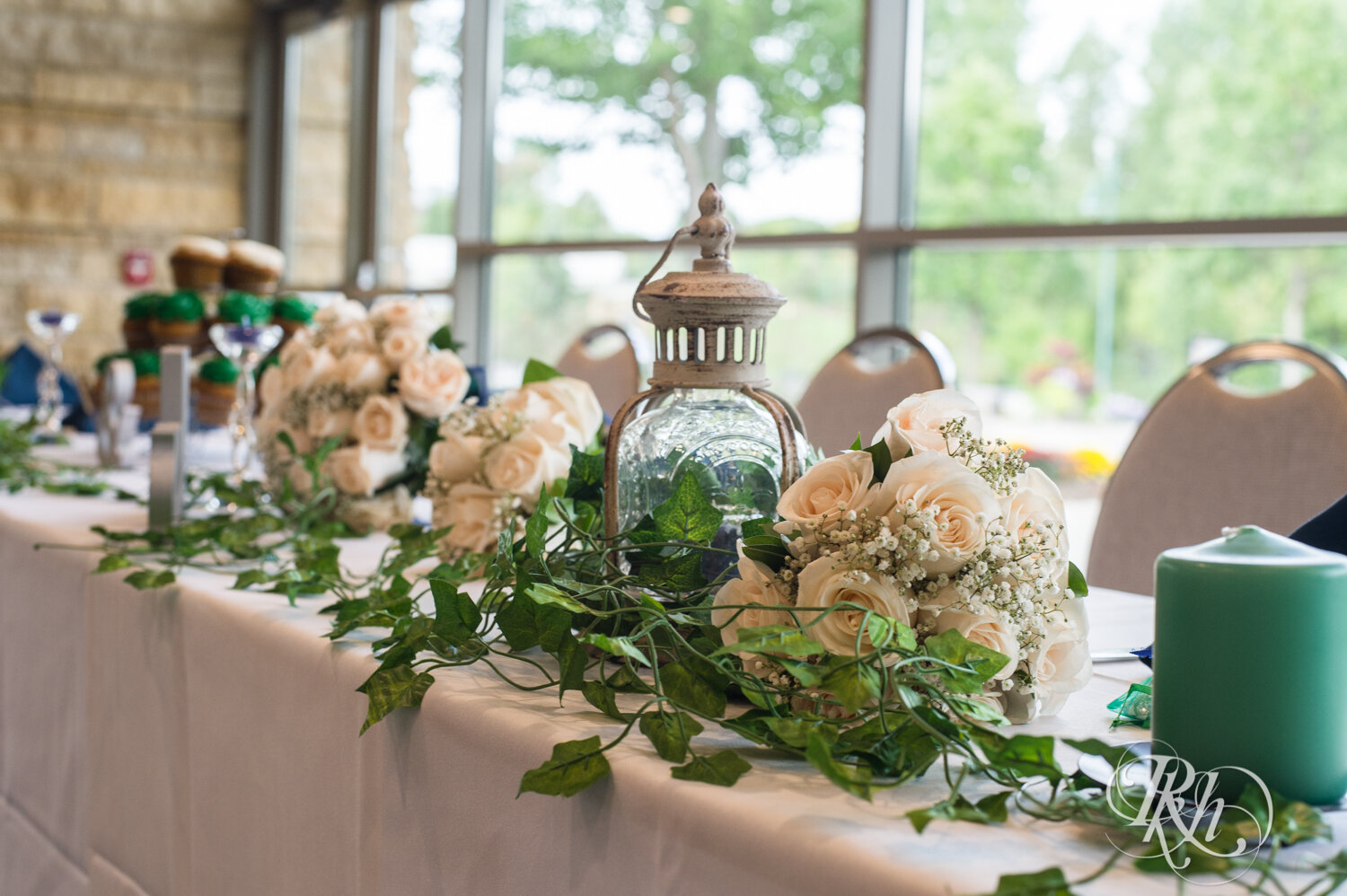 Wedding reception with green and blue accents at Eagan Community Center in Eagan, Minnesota.