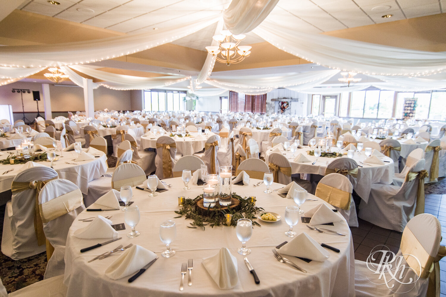Indoor wedding reception setup at The Wilds Golf Club in Prior Lake, Minnesota.