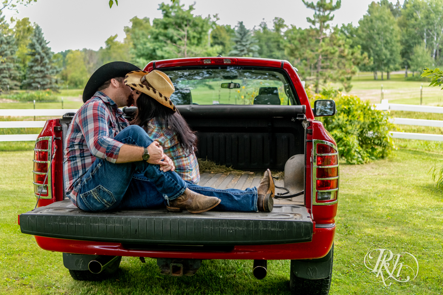 Lebanese woman and man kiss in their pickup truck at their horse farm in Chisago City, Minnesota.