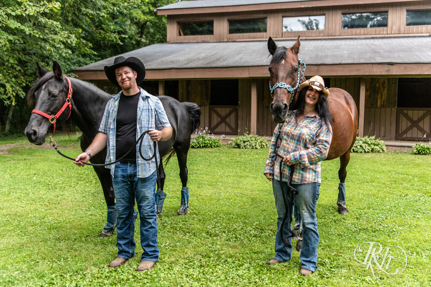 Lebanese woman and man in cowboy hats smile at their horse farm in Chisago City, Minnesota.