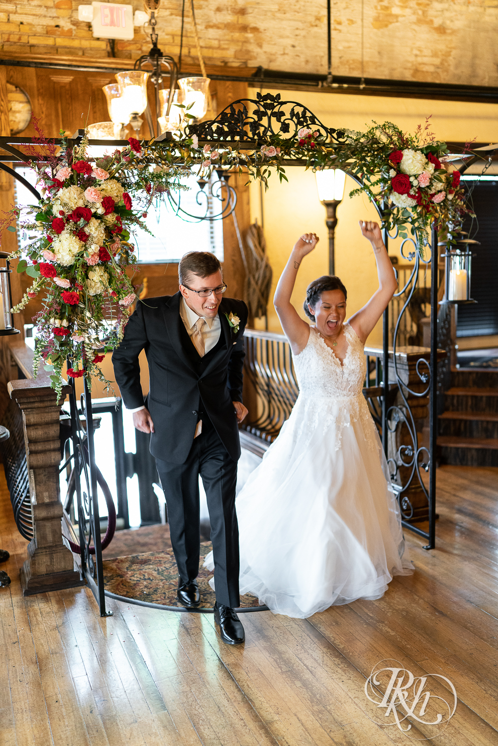 Bride and groom enter wedding reception at Kellerman's Event Center in White Bear Lake, Minnesota.