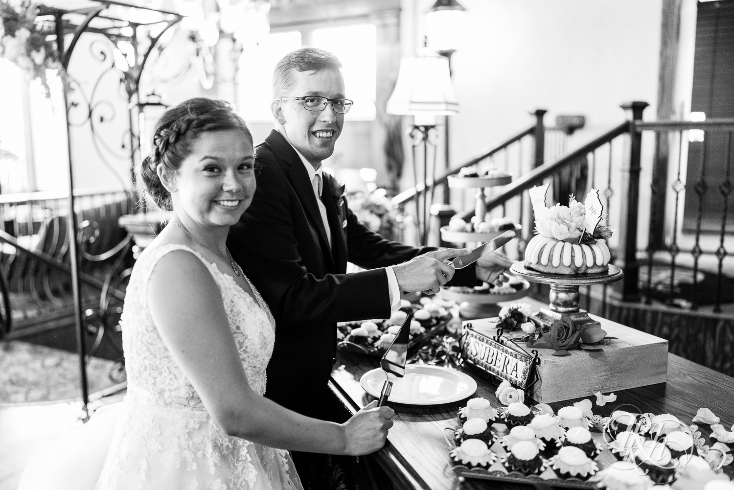 Bride and groom cut cake at wedding reception at Kellerman's Event Center in White Bear Lake, Minnesota.