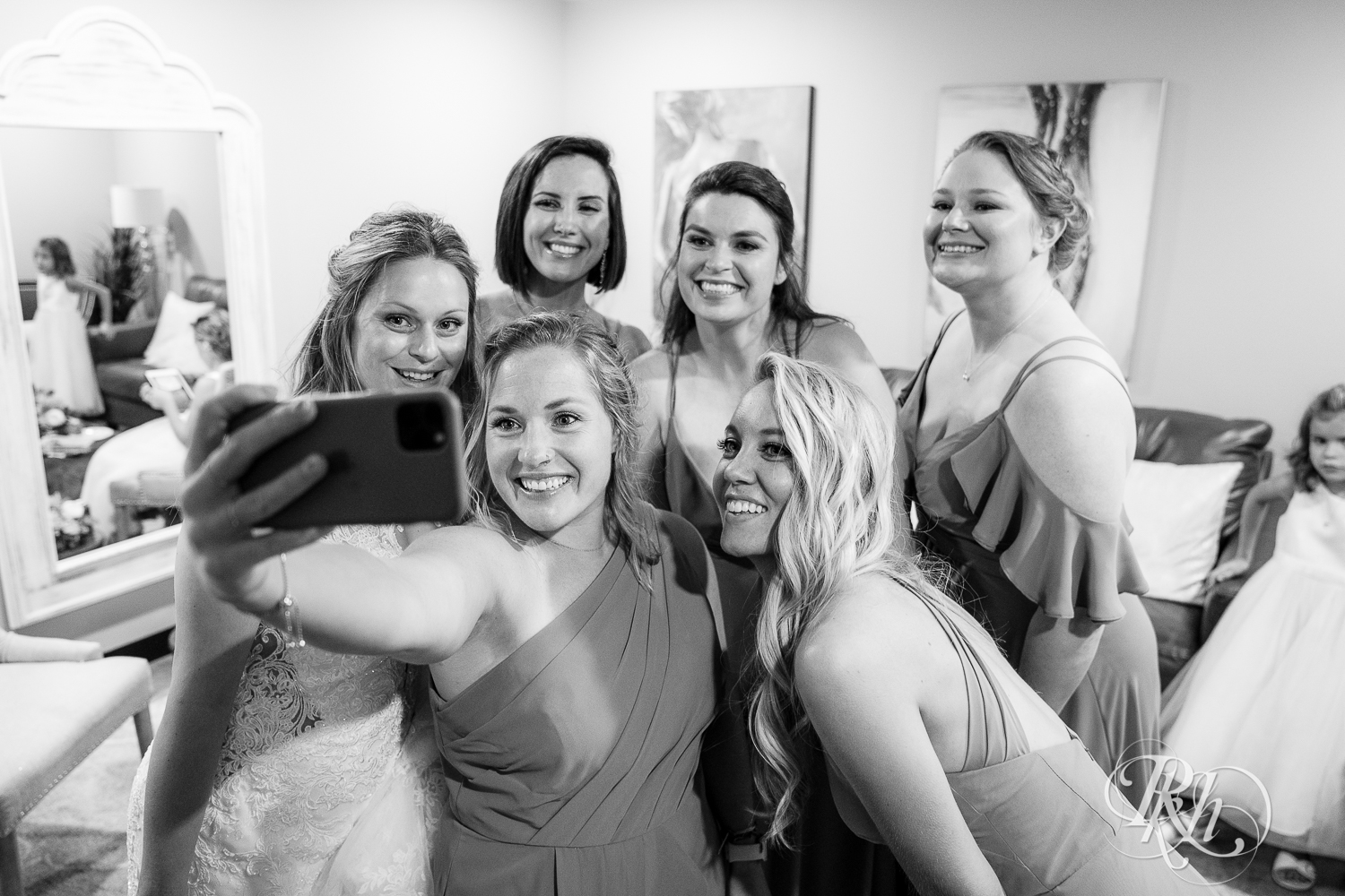 Bride and bridesmaids taking selfie at 7 Vines Vineyard in Dellwood, Minnesota.