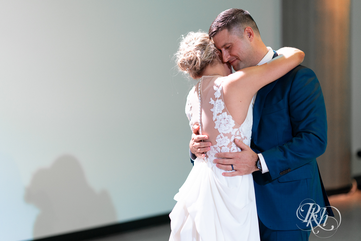 Bride and groom share first dance during wedding at Saint Paul Event Center in Saint Paul, Minnesota.