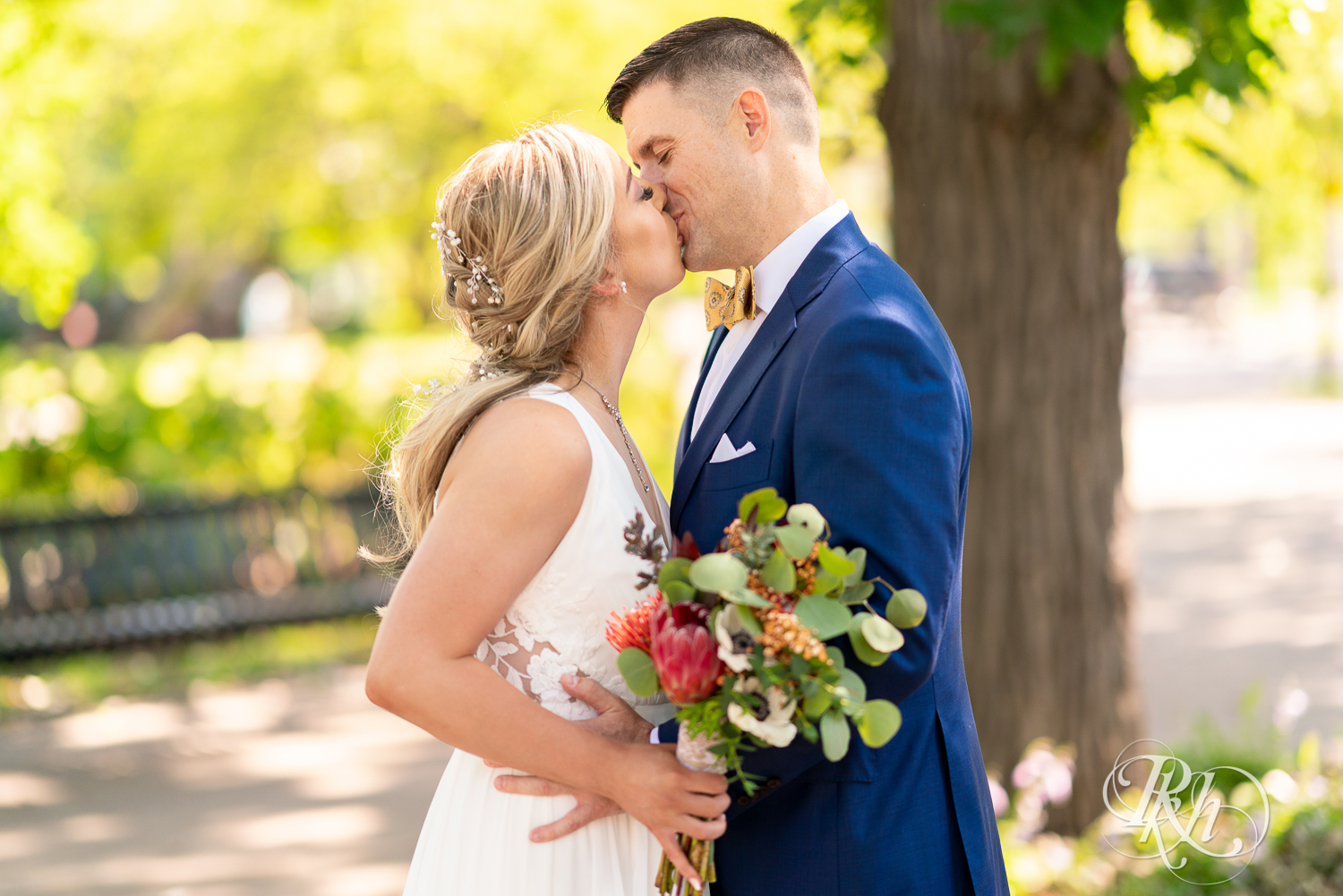 Bride and groom kiss at Irvine Park in Saint Paul, Minnesota.