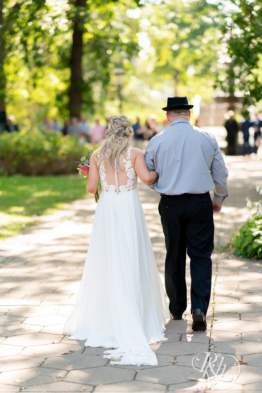 Bride walking down the aisle with her dad at Irvine Park in Saint Paul, Minnesota.