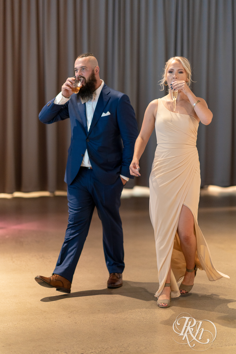Wedding party walks in during grand entrance at Saint Paul Event Center in Saint Paul, Minnesota.