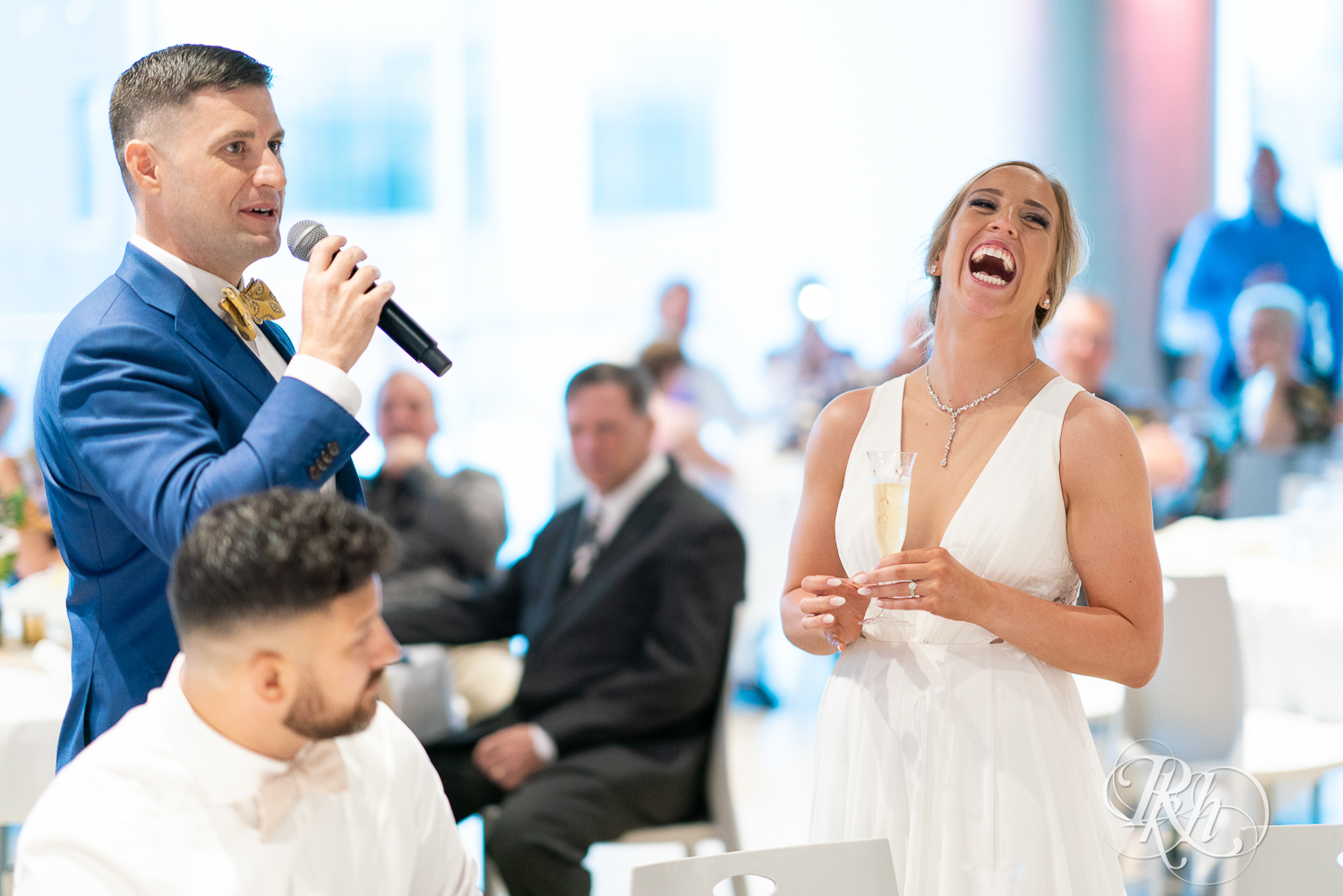 Bride and groom toast during wedding reception at Saint Paul Event Center in Saint Paul, Minnesota.