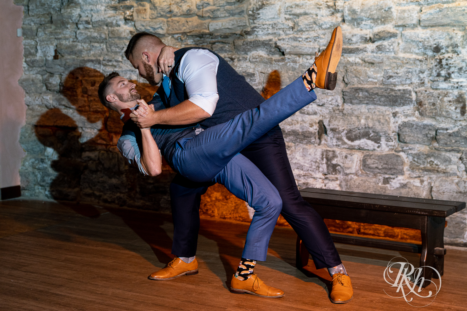 Gay grooms share first dance on wedding day at Hall of Kings in Minneapolis, Minnesota.