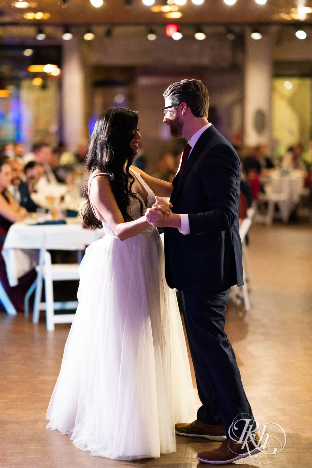 Bride and groom share first dance at wedding reception in Mill City Museum in Minneapolis, Minnesota.