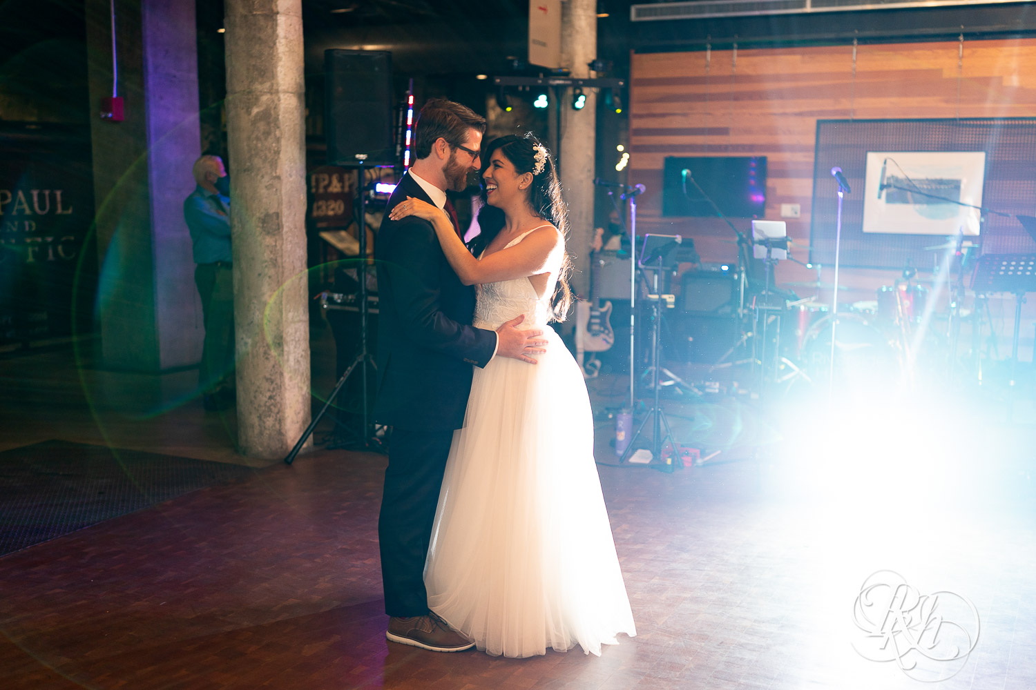 Bride and groom share first dance at wedding reception in Mill City Museum in Minneapolis, Minnesota.