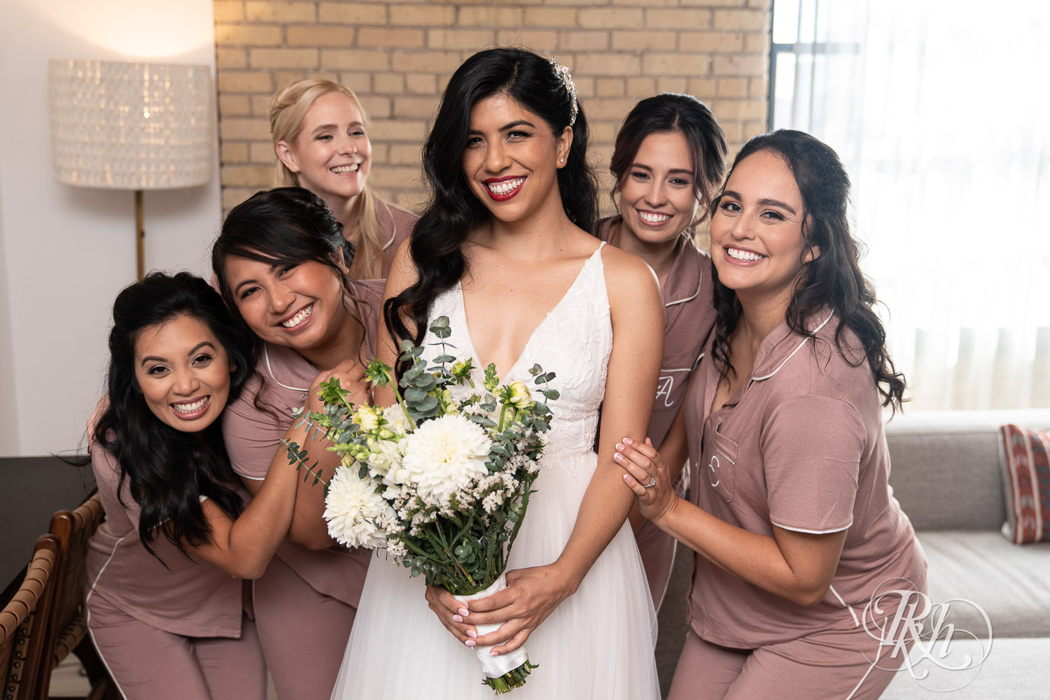 Bride doing first look with her bridesmaids at Hilton Canopy in Minneapolis, Minnesota.