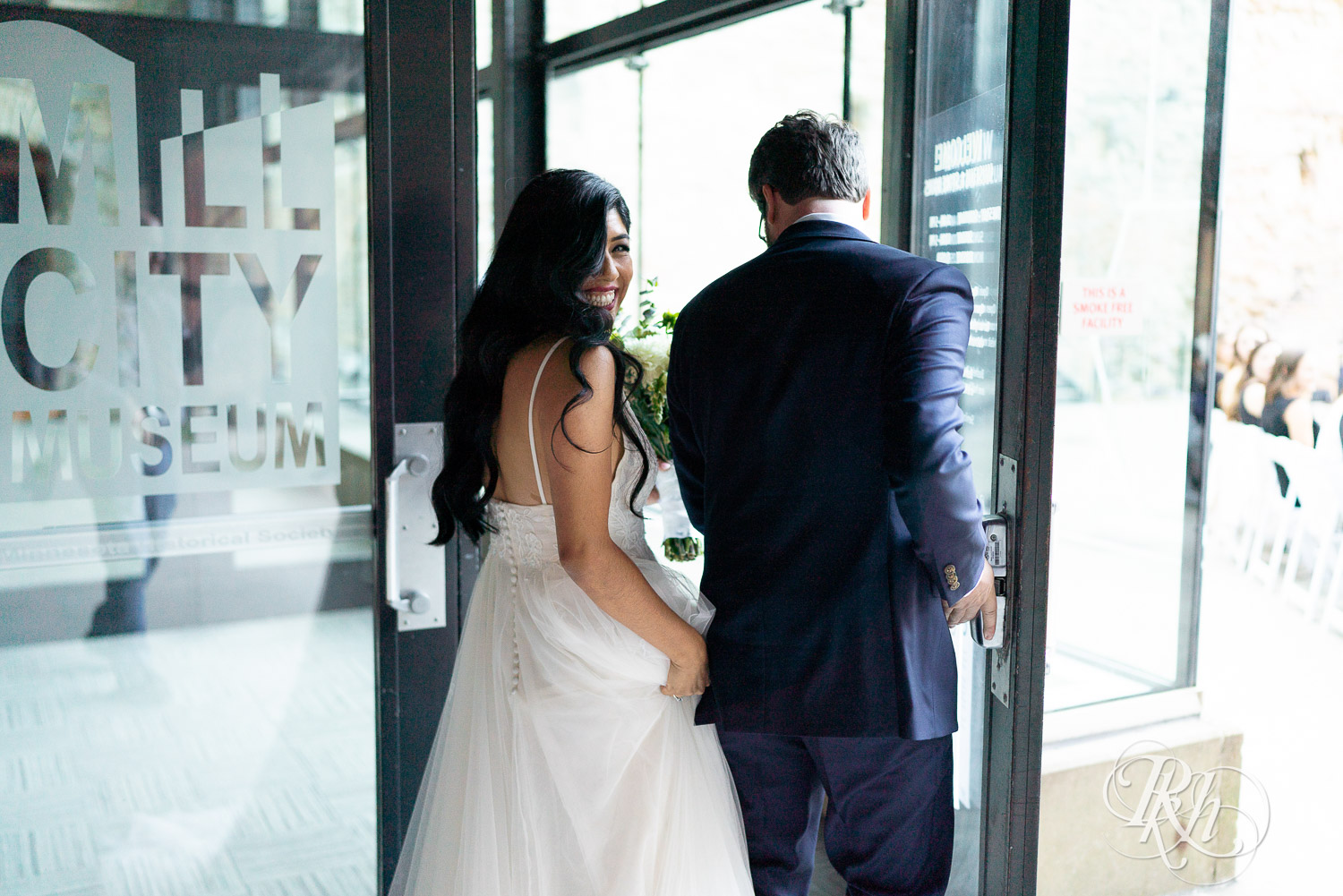 Bride and groom walking down alter after wedding ceremony at Mill City Museum in Minneapolis, Minnesota