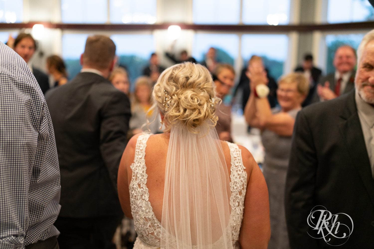 Bride and groom enter reception at Hastings Golf Club in Hastings, Minnesota.