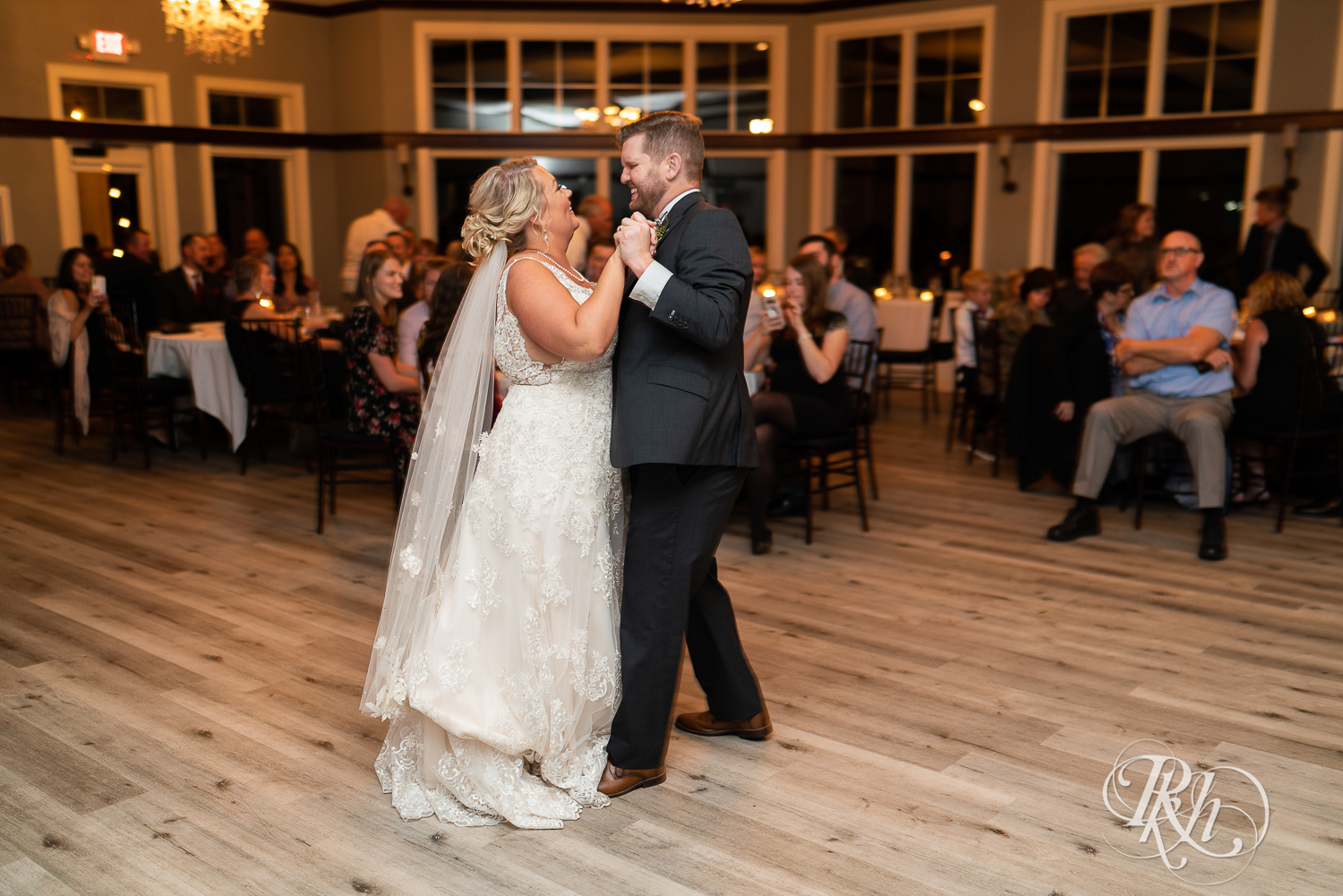 Bride and groom share first dance during wedding reception at Hastings Golf Club in Hastings, Minnesota.