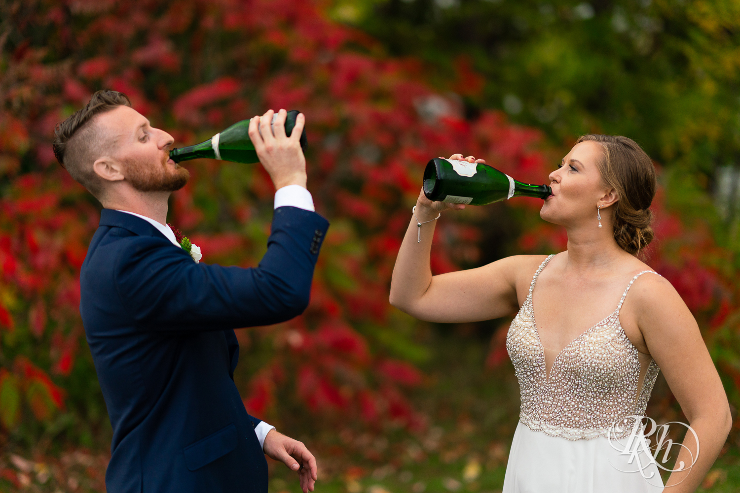 Bride and groom drinking champagne at Schaar's Bluff in Hastings, Minnesota. 