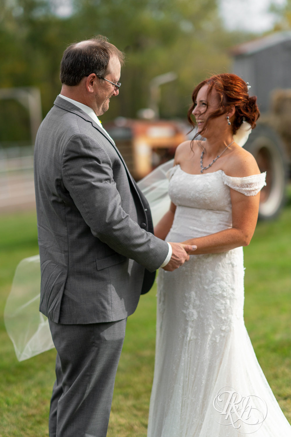 First look between bride and groom at Barn at Crocker's Creek in Faribault, Minnesota.