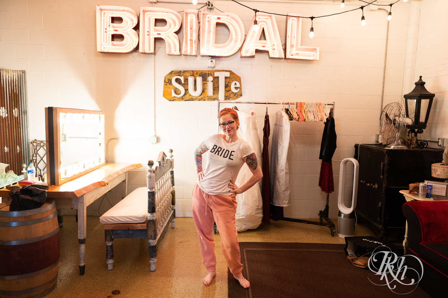 Bride dressed in Bride t-shirt and pink sweatpants at Warehouse Winery in Saint Louis Park, Minnesota.
