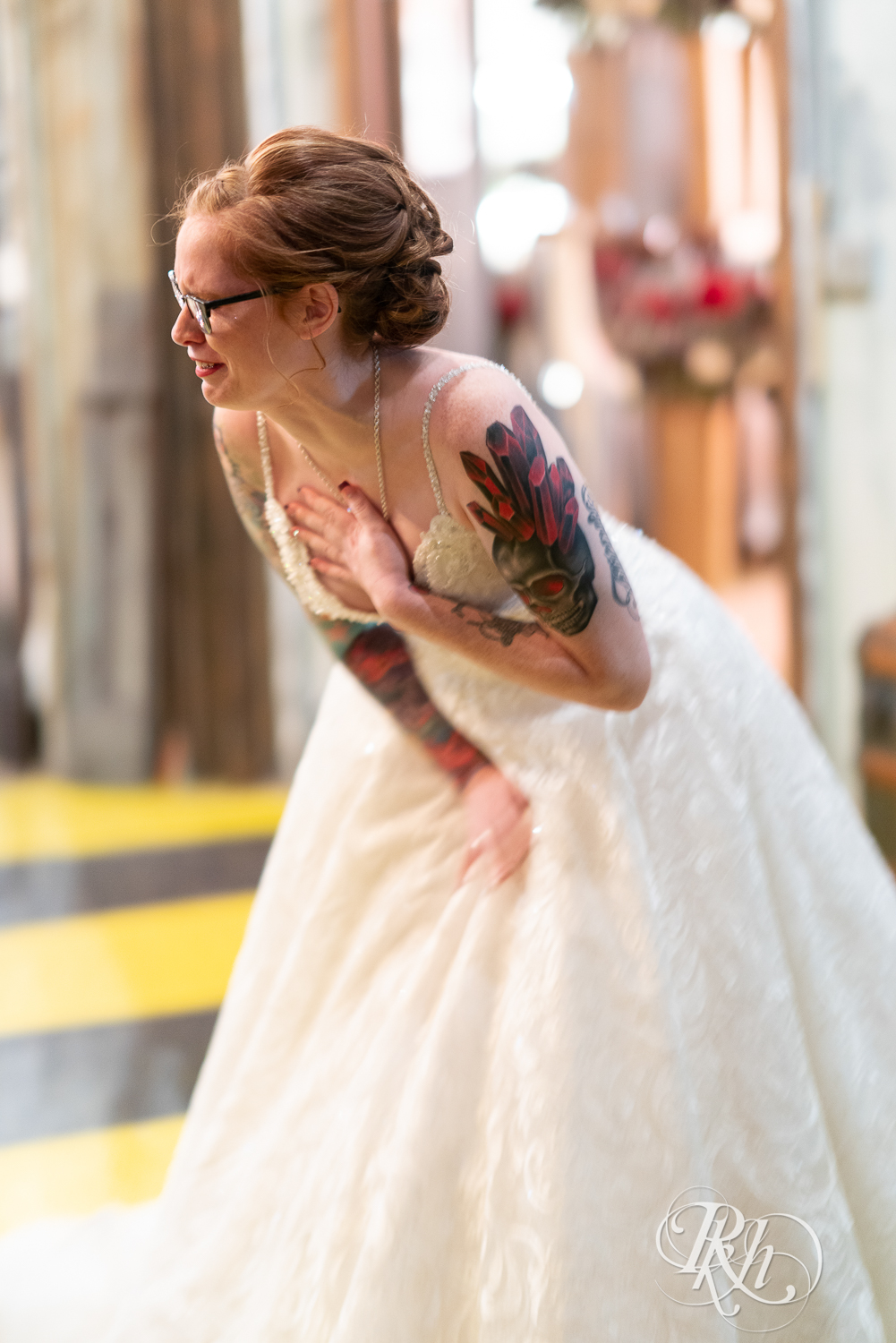 Bride crying during first look between bride and groom at Warehouse Winery in Saint Louis Park, Minnesota.