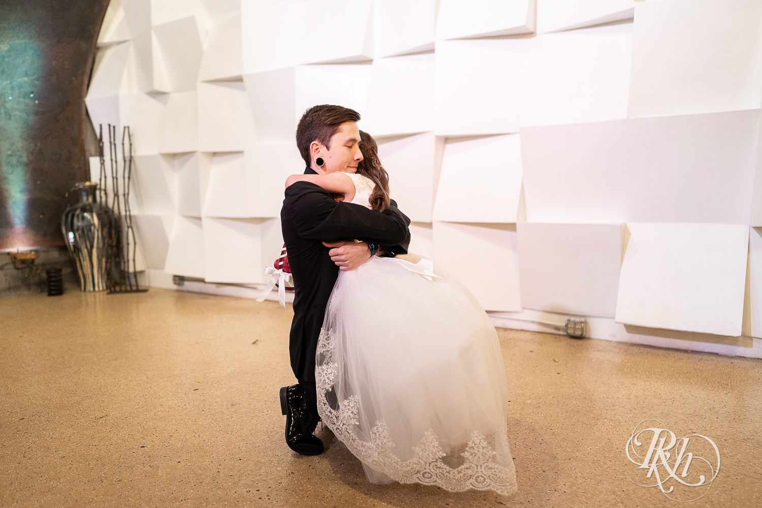 First look between groom and his daughter at Warehouse Winery in Saint Louis Park, Minnesota.