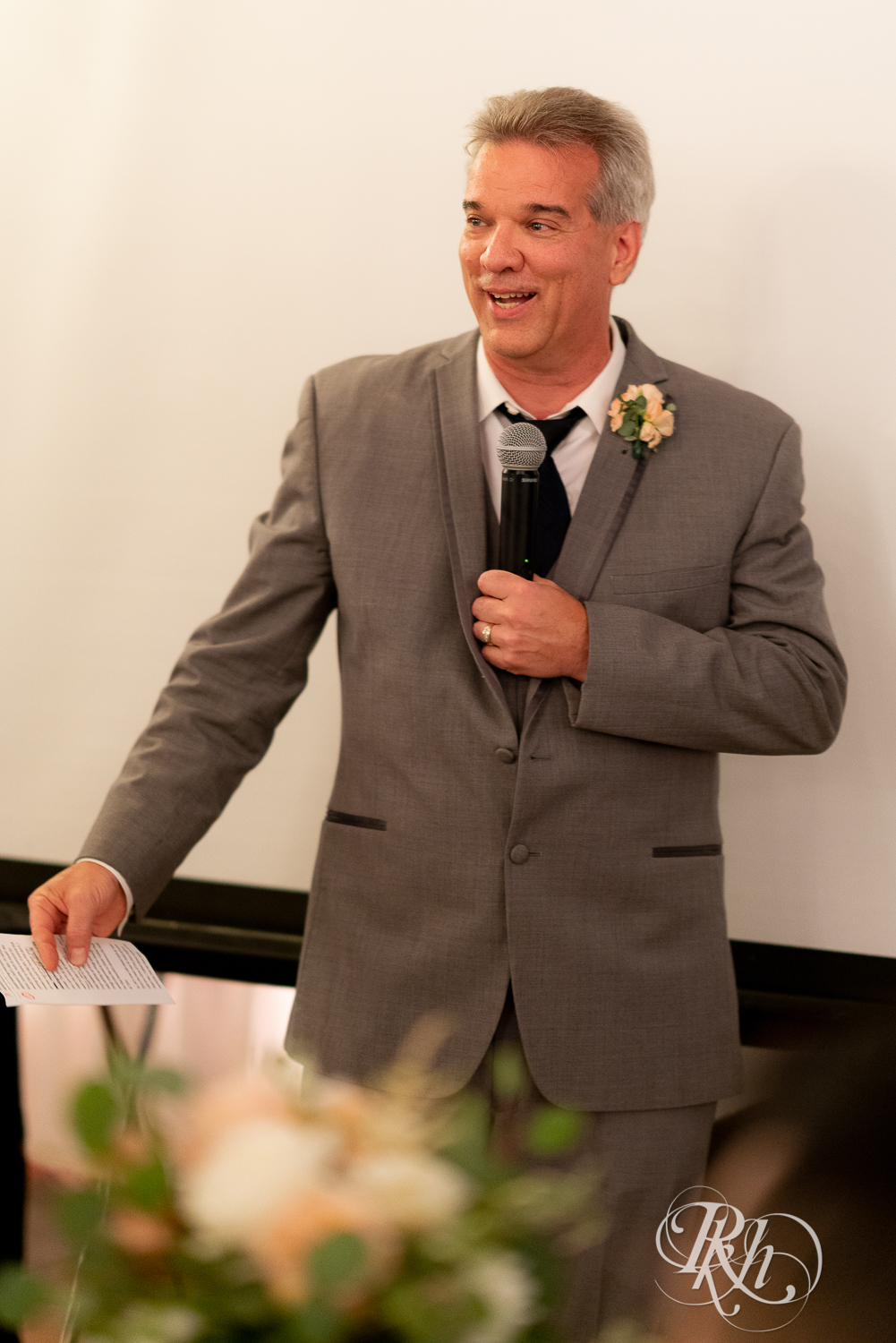 Father cries during speech during reception at The Chart House in Lakeville, Minnesota.